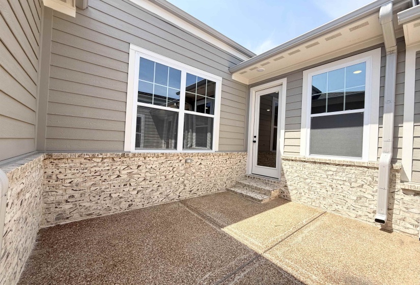 Doorway to property with a patio