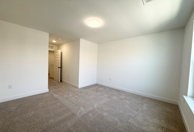 Unfurnished room with carpet and baseboards