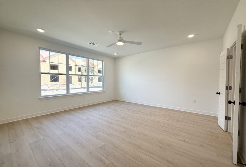 Spare room with a ceiling fan, recessed lighting, and light wood-style flooring