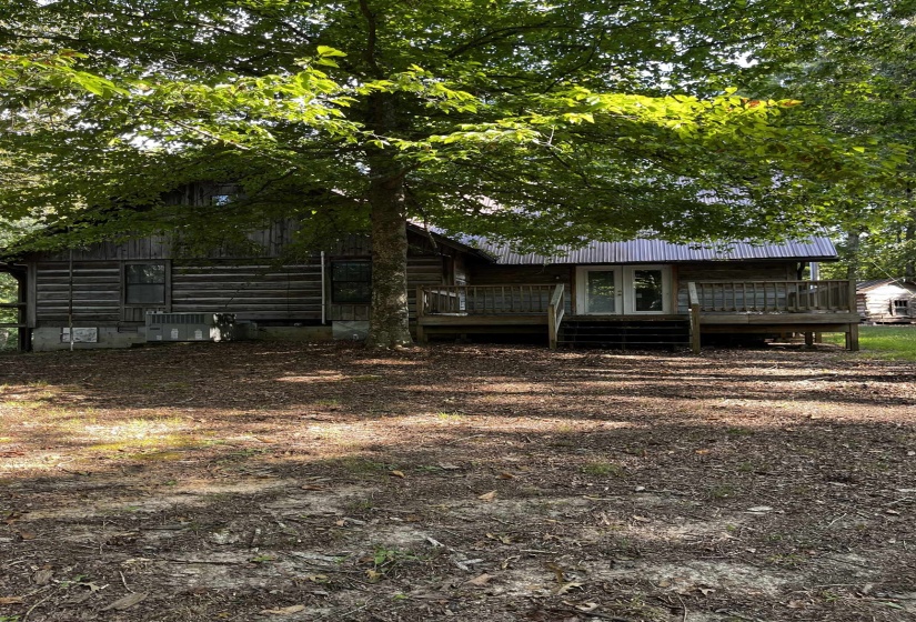Rear view of house featuring a porch, french doors, and a metal roof