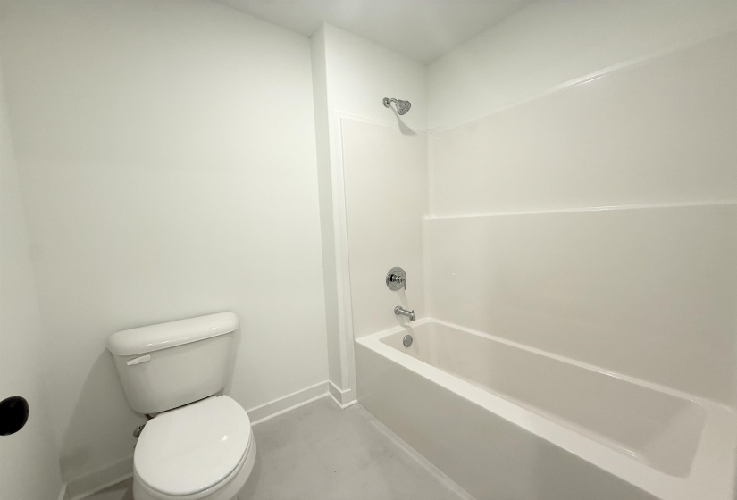 Full bath with toilet and bathtub / shower combination