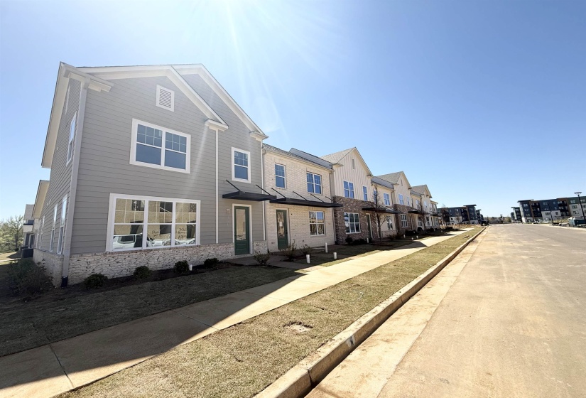 View of front of home with stone siding and a residential view