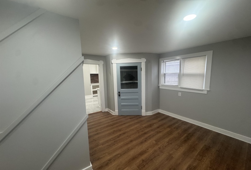 Unfurnished room featuring dark wood finished floors and recessed lighting