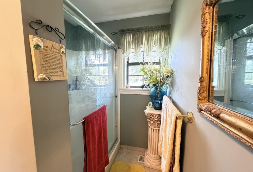 Full bath with a shower stall