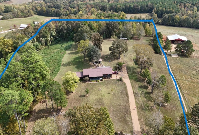 Aerial overview of property's location with rural landscape and property parcel outlined