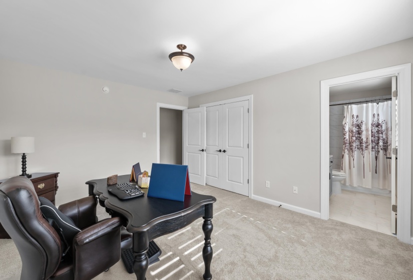 Carpeted home office with baseboards