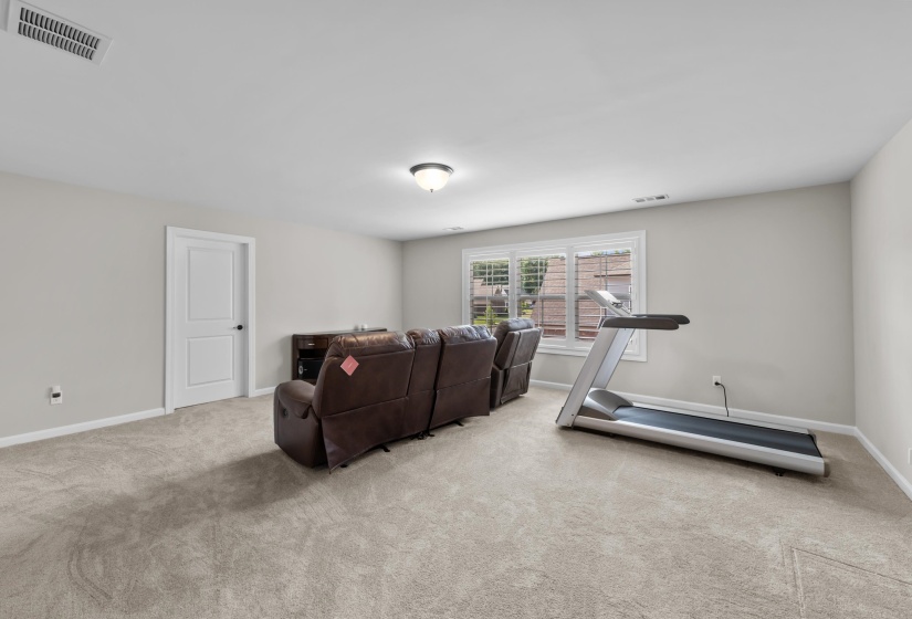 Exercise area featuring carpet floors