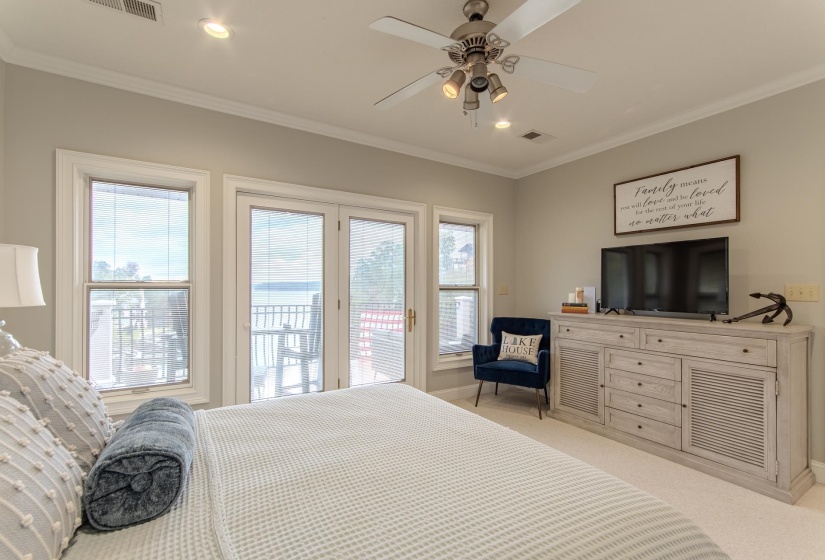 Bedroom with ornamental molding, light colored carpet, access to exterior, a ceiling fan, and recessed lighting