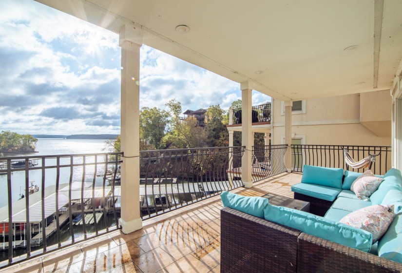 Balcony with a water view and an outdoor hangout area