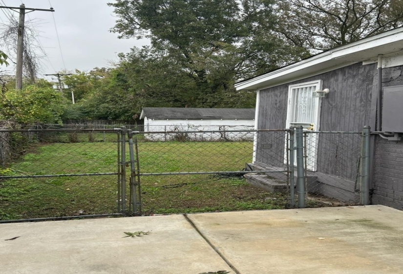 View of yard with a gate