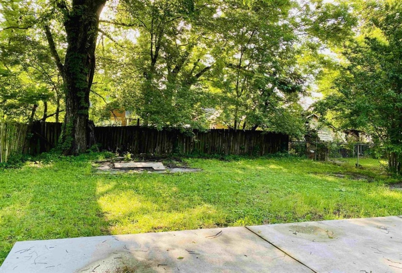 Fenced backyard featuring a patio