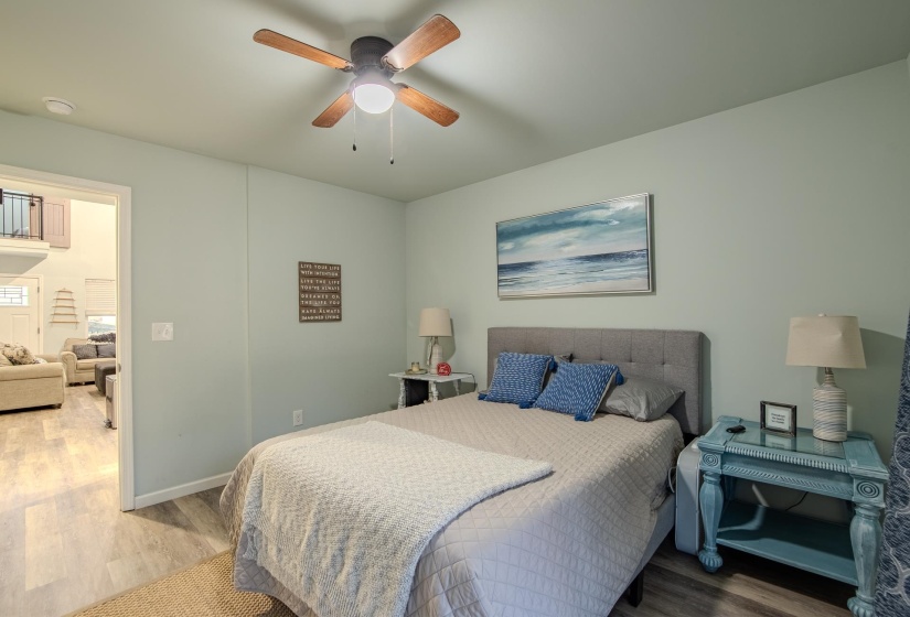 Bedroom with wood finished floors and ceiling fan