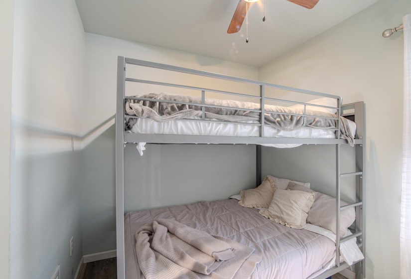 Bedroom featuring ceiling fan and baseboards