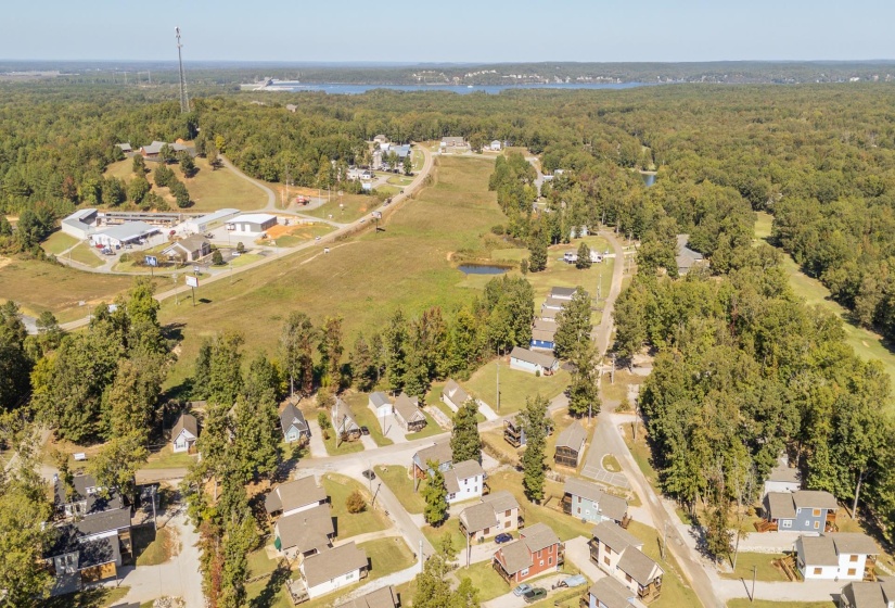 Aerial overview of property's location with nearby suburban area and a large body of water