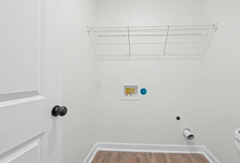 Laundry room with washer hookup, dark wood-style floors, and electric dryer hookup