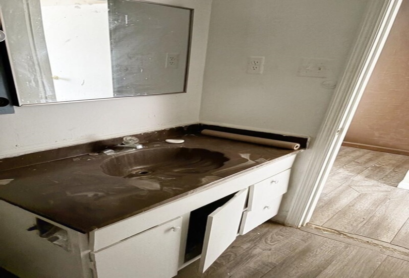 Bathroom with vanity and light wood finished floors