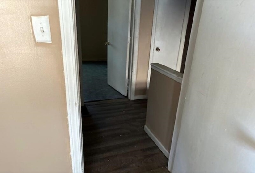 Hall featuring a textured wall