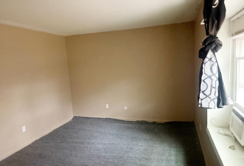 Unfurnished room with carpet