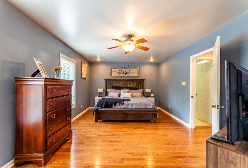 Bedroom featuring light wood-type flooring and a ceiling fan