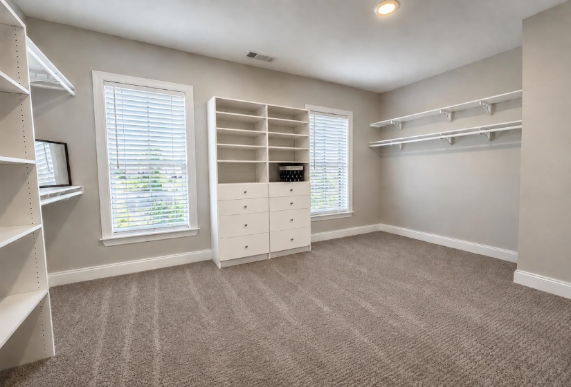 Additional smaller walk-in closet also in luxury spa bath.