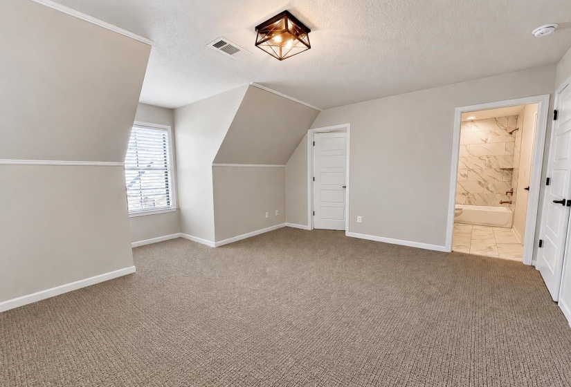 Access into additional full bath upstairs.