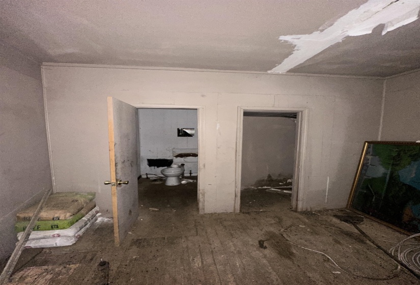Empty room with dark wood-type flooring