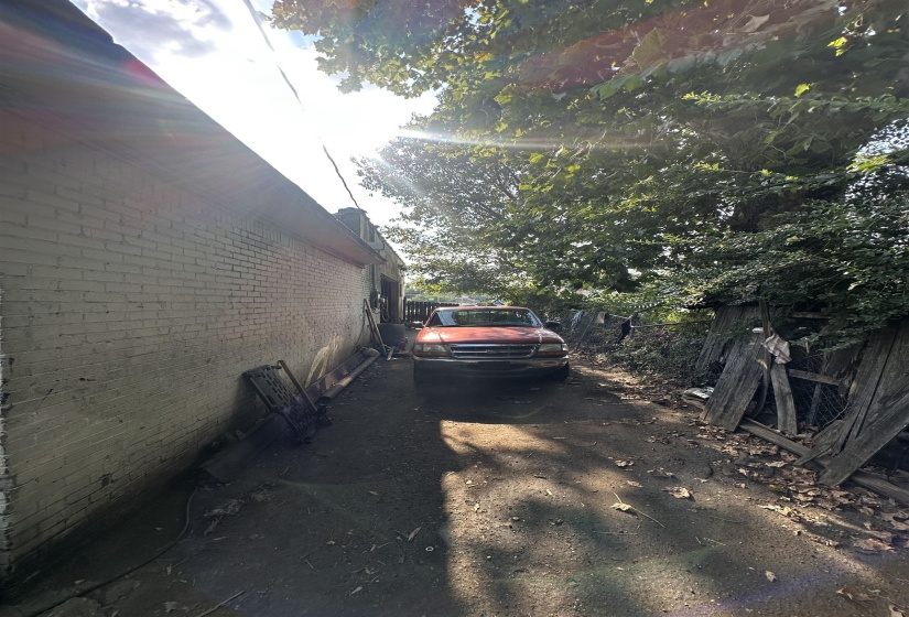 View of side of property featuring brick siding