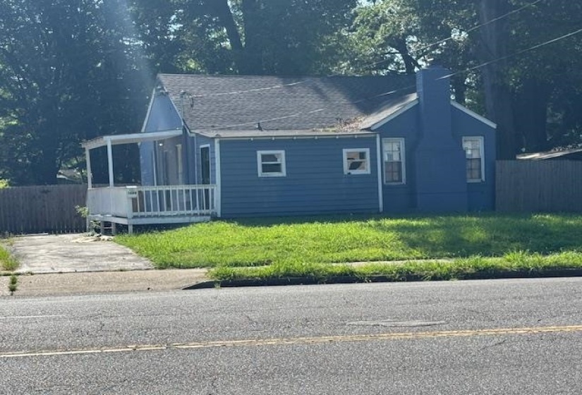 View of front of property featuring a chimney