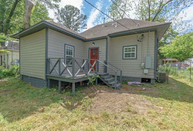 Rear view of house with a shingled roof