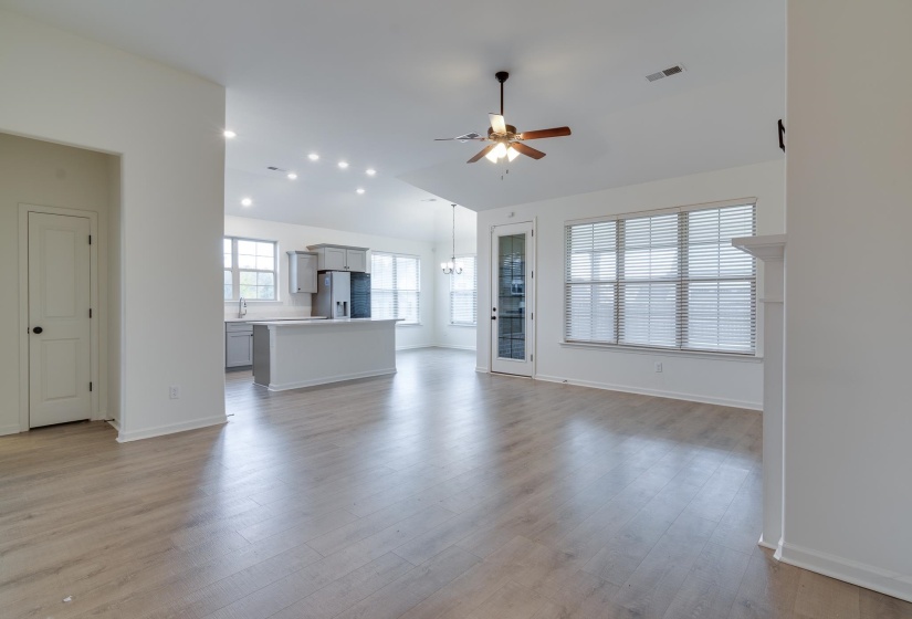 Unfurnished living room with light wood-style floors, a ceiling fan, and recessed lighting