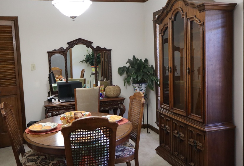 Dining area with light carpet