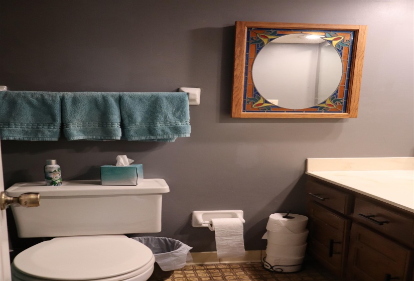 Half bath featuring vanity and toilet