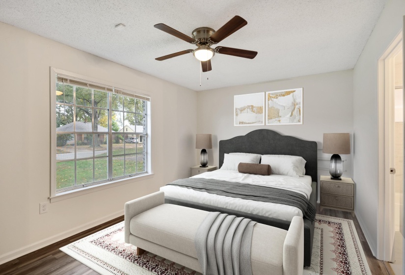 Bedroom with wood finished floors, a textured ceiling, and a ceiling fan