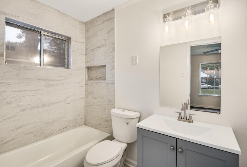 Full bathroom featuring vanity and bathtub / shower combination