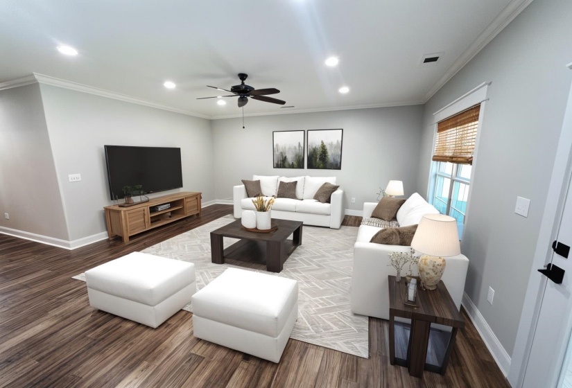 Living room featuring ornamental molding, recessed lighting, wood finished floors, and ceiling fan