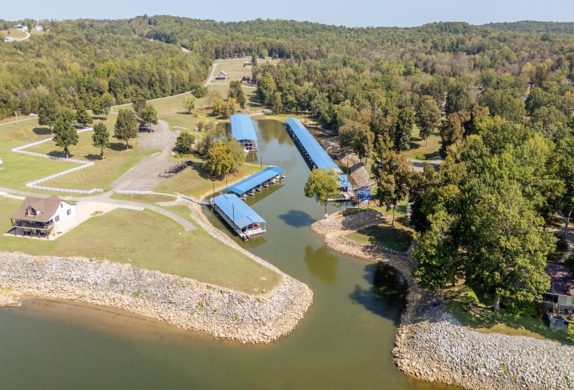 Drone / aerial view of a large body of water and a forest