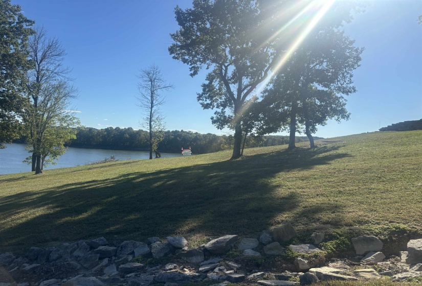 View of yard with a water view
