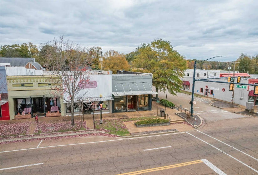 View of property with uncovered parking