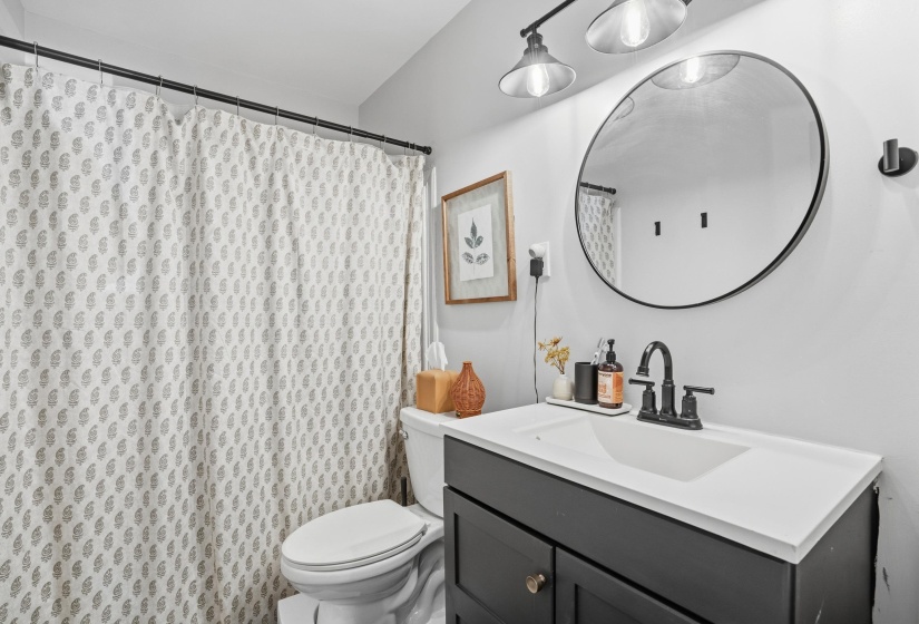Bathroom featuring vanity and a shower with curtain