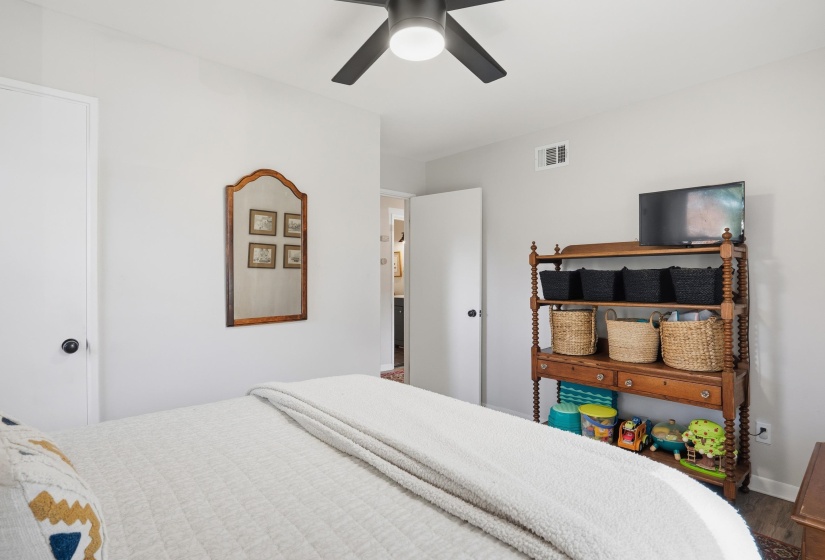 Bedroom with wood finished floors and a ceiling fan