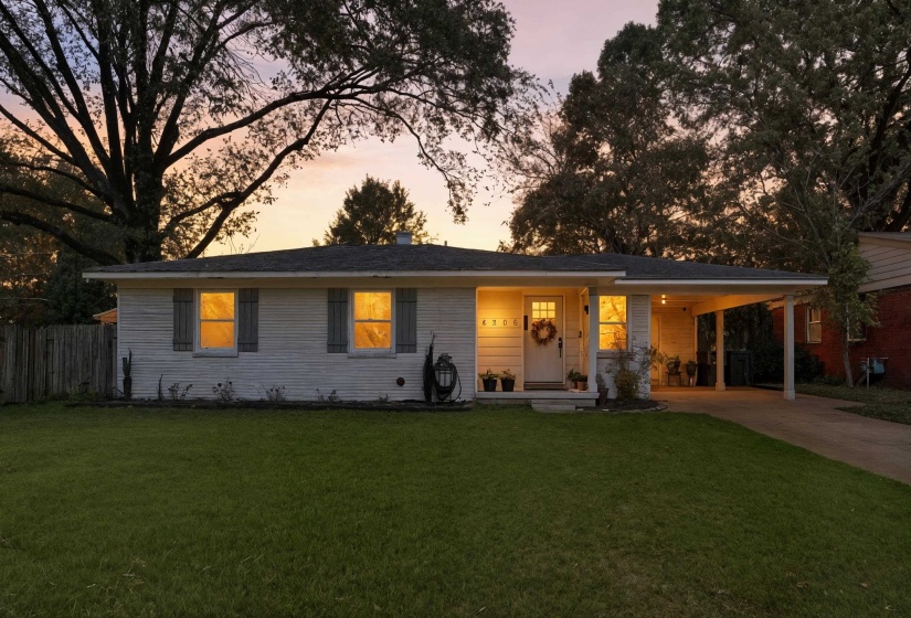 Ranch-style house featuring covered porch, a carport, and driveway
