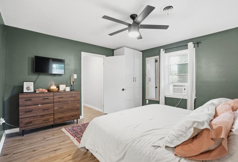 Bedroom featuring light wood-style floors and a ceiling fan