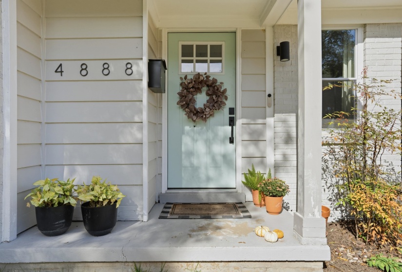 Doorway to property featuring a porch