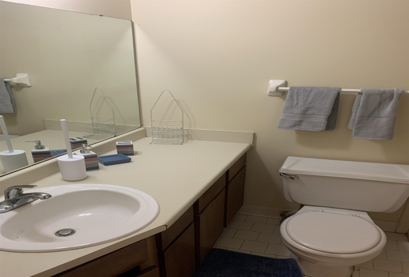 Bathroom featuring light tile patterned flooring and vanity