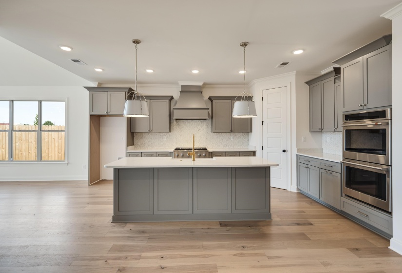 Stunning chef's kitchen with gray soft close cabinets