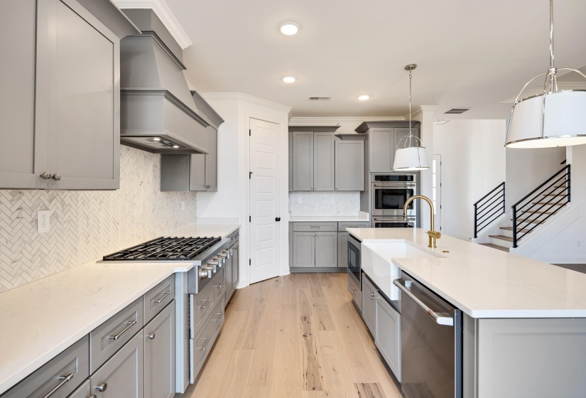 Stainless steel appliances and massive island.
