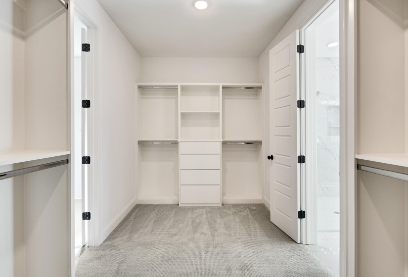 Massive primary closet with custom built shelving