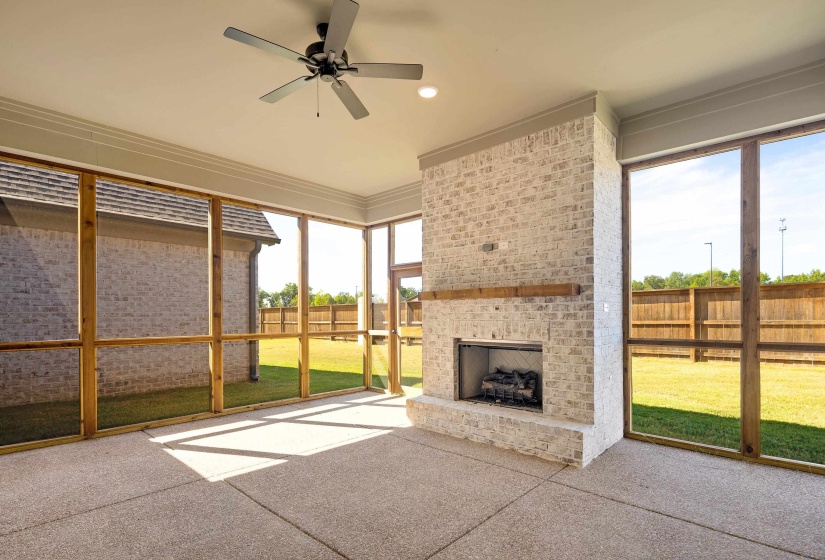 Large, screened in outdoor living area with gas fireplace! The perfect spot for your morning coffee or to unwind after a long day.