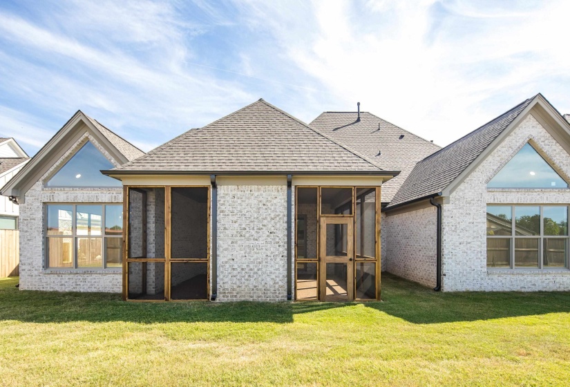 Backyard and facing back of home. Check out those stunning windows!