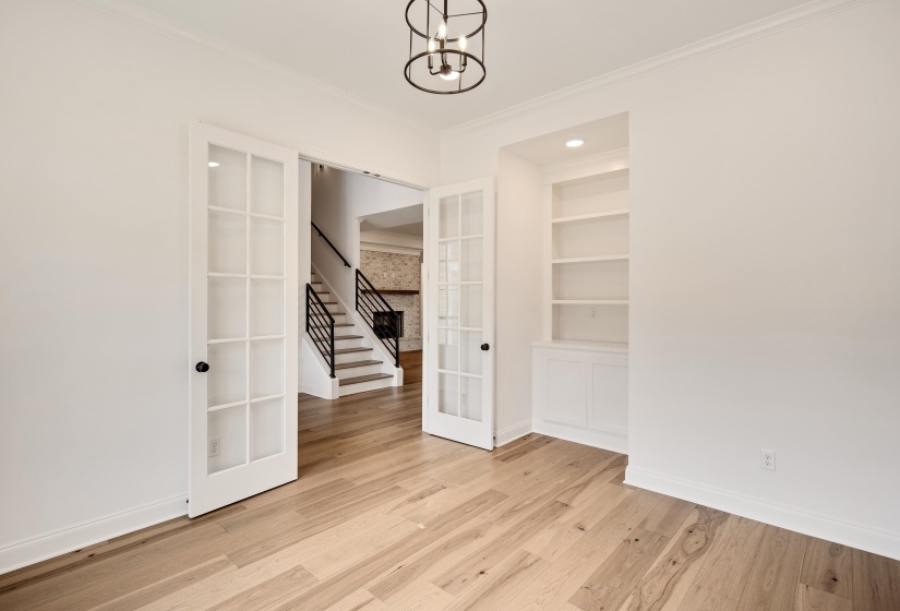 Custom built ins and french doors